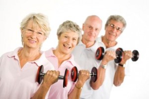 Mature older people lifting weights